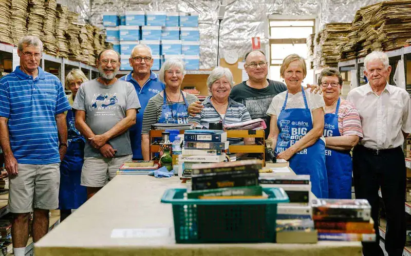 Lifeline volunteers sorting books at a Lifeline shop