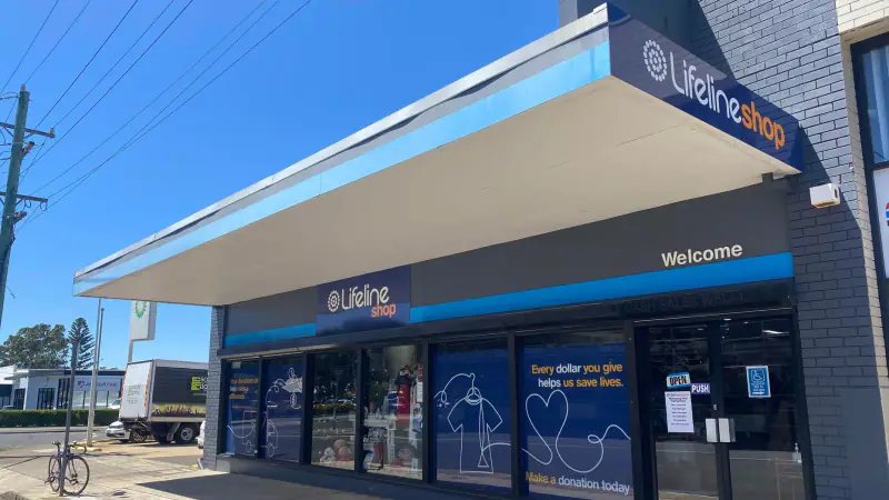 The Lifeline Wollongong Shop seen from the street, with the Lifeline Shop sign above the entrance